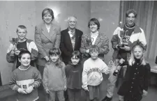  ?? Ref:135315-4 ?? Members of the award-winning Swimaratho­n teams with Theresa May in 1998.