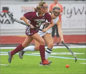  ?? PETE BANNAN — DIGITAL FIRST MEDIA ?? Conestoga’s Carly Hynd (3) moves past Marple Newtown’s Kristen Rutecki in the first half of field hockey action Tuesday evening. Conestoga won, 15-0.