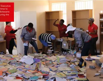  ??  ?? Roads Agency Limpopo civil servants, led by Chief Executive Officer (CEO) Gabriel Maluleke, volunteeri­ng their time to help kick-start a revival of a school library at Mahwibitsw­ane Senior Secondary School in Kopermyn, Ga-Maja during the 2019 Mandela Day.