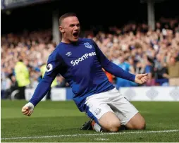  ?? (Reuters) ?? EVERTON’S WAYNE ROONEY celebrates scoring his team’s winner against Stoke City after returning to the club from Manchester United.