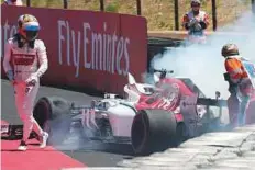  ?? Rex Features ?? Marcus Ericsson of Alfa Romeo Sauber walks away unscathed after a crash during French GP practice.