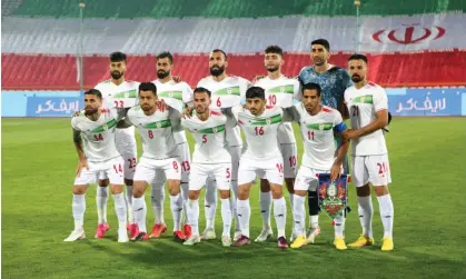  ?? Photograph: Anadolu Agency/Getty Images ?? Iran’s national football team: ‘uncomforta­bly aware of the regime’s efforts to use football (and them) to distract attention from the crisis at home.’