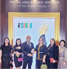  ?? ?? Sabah Tourism Board staff with the Silver award at the Putra Aria Brand Awards 2023.