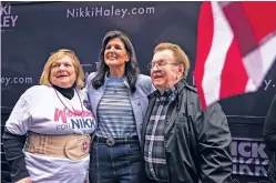  ?? MATT KELLEY/THE ASSOCIATED PRESS ?? Republican presidenti­al candidate Nikki Haley, center, takes a photo with attendees at a campaign event Saturday in Newberry, S.C.