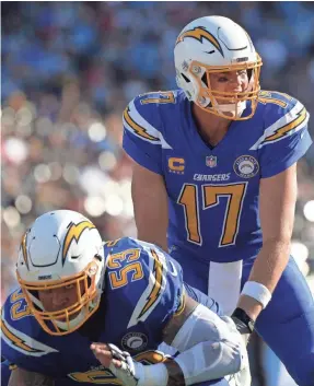  ?? JAKE ROTH/USA TODAY SPORTS ?? Chargers quarterbac­k Philip Rivers set two NFL completion-related records, including percentage, in Week 12.