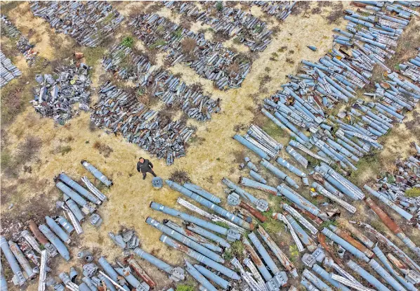  ?? ?? Dmytro Chubenko stands in the ‘graveyard’ of Russian missiles that could provide evidence of Kremlin war crimes