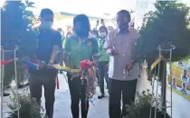  ??  ?? PCSO GM Royina Garma (center) is joined by Lingayen Mayor Leopoldo Bataoil (right) and Pangasinan Governor Amado Espino III during the ribbon cutting ceremony of the newly opened PCSO office in Pangasinan.