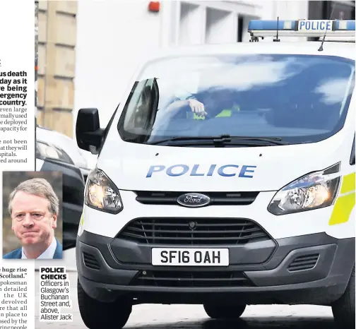  ??  ?? POLICE CHECKS Officers in Glasgow’s Buchanan Street and, above, Alister Jack