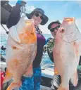  ?? Picture: Jason Swan ?? Leanne Hewitt and Jason Swan with an excellent red emperor and large mouth nannygai caught in the deep water off Cairns on Easter Sunday.