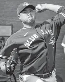  ?? DOUGLAS DEFELICE • USA TODAY SPORTS ?? Toronto Blue Jays starting pitcher Hyun-jin Ryu warms up during spring training workouts in Dunedin, Fla., in February.