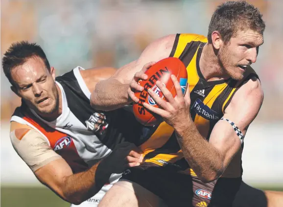  ?? Picture: GETTY ?? Hawthorn’s Ben McEvoy is tackled by St Kilda’s Nathan Brown in the Round 6 AFL match in Launceston yesterday