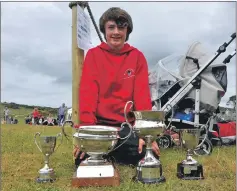  ??  ?? Sam MacKenzie with his hoard of trophies. 21_ F25 road to the isles 08