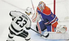  ?? LARRY WONG ?? Oilers goalie Mikko Koskinen stones Kings shooter Dustin Brown during the second period on Thursday night.