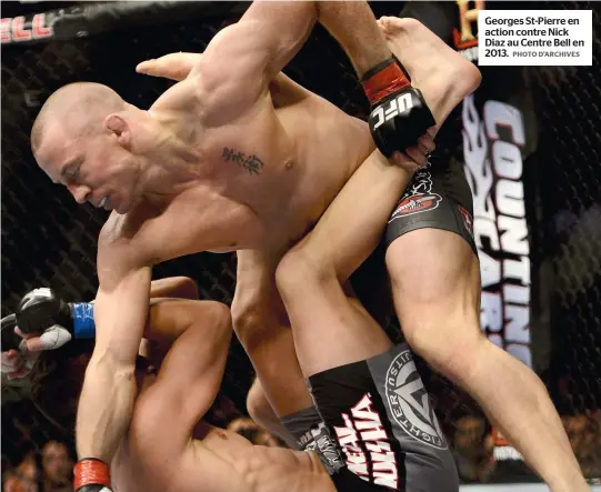  ?? PHOTO D’ARCHIVES ?? Georges St-pierre en action contre Nick Diaz au Centre Bell en 2013.