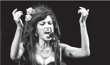  ?? — Reuters file photo ?? Winehouse performs at the Glastonbur­y Festival 2008 on June 28, 2008.