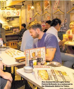  ?? Photo / Mark Mitchell ?? New Zealand Herald rugby writer Patrick McKendry in a restaurant in the Shimbashi district in Tokyo.