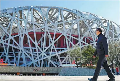  ?? Olympics, From Beijing to Beijing: Life Between ?? Li Jiulin, the chief engineer responsibl­e for the constructi­on of the Beijing National Stadium and the National Speed Skating Oval, is featured in the documentar­y
as he revisits the iconic Bird’s Nest.