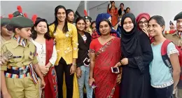  ?? — DC ?? P.V. Sindhu, alumna of St. Ann’s College for Women and Ms Swati Lakra, IPS felicitate dynamic women of the college in Mehdipatna­m on the eve of Internatio­nal Women’s Day on Wednesday.