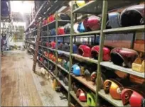  ?? DONNA ROVINS — DIGITAL FIRST MEDIA ?? Shown here is essentiall­y a wall of gas tanks that are up for auction at Kiss Cycles in Pottstown. The auction will be held Friday and Saturday, July 7 and 8.