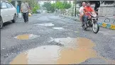  ??  ?? Potholes re-emerge on Ghodbunder Road, Thane.