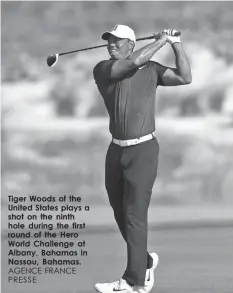  ?? AGENCE FRANCE PRESSE ?? Tiger Woods of the United States plays a shot on the ninth hole during the first round of the Hero World Challenge at Albany, Bahamas in Nassau, Bahamas.