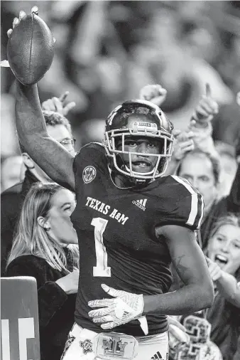  ?? David J. Phillip / Associated Press ?? Texas A&amp;M wide receiver Quartney Davis celebrates after catching a touchdown pass to tie the game during the seventh overtime against LSU on Saturday at Kyle Field.