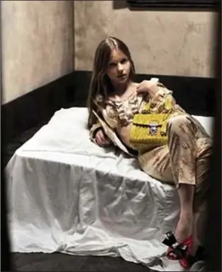  ?? ?? Provocativ­e: Mia Goth reclines in the advertisem­ent for Prada’s Miu Miu line