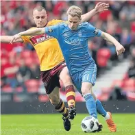  ??  ?? Tussle: Liam Grimshaw, left, and Gary Mackay-Steven