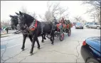  ?? Matthew Brown / Hearst Connecticu­t Media ?? Touches like the horse-drawn wagon that brought people up and down Greenwich Avenue during the holiday stroll will not be able to continue in 2020.