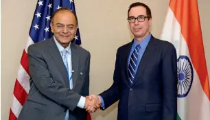  ?? — Reuters ?? Arun Jaitley shakes hands with Steven Mnuchin prior to a bilateral meeting, as part of the IMF and World Bank’s 2017 Annual Spring Meetings on Saturday in Washington DC.