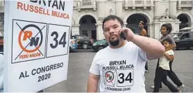  ?? MARTIN MEJIA/AP ?? Bryan Russell, who is running for Parliament, may be the first person with Down syndrome to run for public office anywhere, says the Global Down Syndrome Foundation.