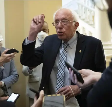  ?? Getty iMAges ?? GETTING EXERCISED: Sen. Bernie Sanders, I-Vt., speaks to reporters at the U.S. Capitol in Washington, D.C., on Thursday about the $3.5 trillion spending plan.
