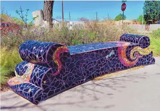  ?? ?? This ceramic-tile covered bench is one of four at “The Poet’s Plaza” at Seventh Street and Mountain Road.