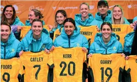  ?? Photograph: William West/AFP/Getty Images ?? Australia's women's football captain Sam Kerr (2nd R), flanked by teammates Stephanie Catley (L), Caitlin Foord (2nd L) and Katrina Gorry-Lee Gorry (R), pose with the rest of their team after being presented with their jerseys at a public event in Melbourne on July 11, 2023