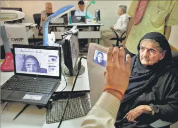  ?? GETTY IMAGES ?? The Supreme Court on Wednesday declared the Centre’s flagship Aadhaar scheme as constituti­onally valid but struck down some of its provisions, including its linking with bank accounts, mobile phones and school admissions.