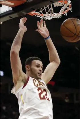  ?? TONY DEJAK — THE ASSOCIATED PRESS ?? Larry Nance Jr. dunks against the Pistons on March 5 at Quicken Loans Arena.