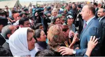  ??  ?? AZERBAIJAN’S PRESIDENT Ilham Aliyev meets with Azerbaijan­i refugees from Nagorno-Karabakh at a special camp for internally displaced persons (IDP) in 2018. (Sputnik.az)