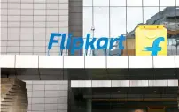  ?? — Bloomberg ?? Flipkart signage is displayed outside the company’s headquarte­rs in Bengaluru. Flipkart has become India’s most valuable startup and introduced online shopping to the masses.