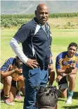  ?? UWC JEFFREY ABRAHAMS ?? UWC’s varisty Cup coach, Chester Williams, talks to his team. |