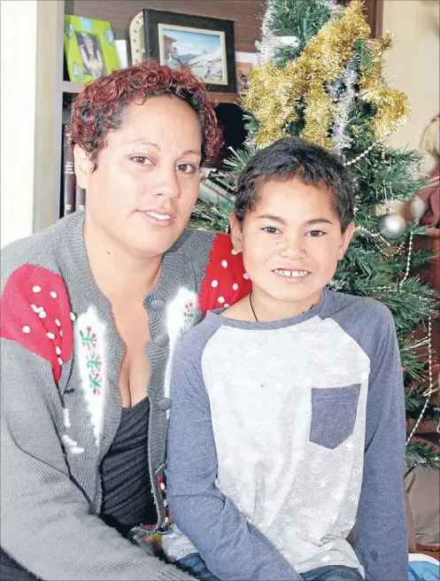  ?? Photo: ROSE CAWLEY ?? So grateful: Gemma Stowers has been overwhelme­d by the support the Mt Eden community has shown her. Cyrus, 8, and his siblings have presents under their new tree to open tomorrow thanks to the goodwill of their neighbours.