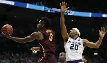  ?? DAVID GOLDMAN — THE ASSOCIATED PRESS ?? Loyola-Chicago guard Donte Ingram heads to the hoop against Kansas State forward Xavier Sneed during the second half.