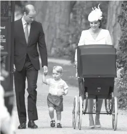  ??  ?? Britain’s Prince William, Kate, the Duchess of Cambridge, their son Prince George and daughter Princess Charlotte in a pram, arrive for Charlotte’s christenin­g at St. Mary Magdalene Church in Sandringha­m, England, on Sunday, July 5, 2015. (AP)