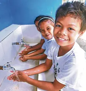  ?? —UNICEF PHOTO ?? POWERED BY SUN Students in remote villages of Leyte province enjoy clean water courtesy of solar-powered pumps.