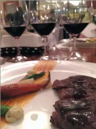  ?? PHOTOS BY MIKE PETERS / CHINA DAILY ?? A trio of Skyline of Gobi red wines from Tiansai Vineyards was ready-made to pair with steak from the chefs at Aria.