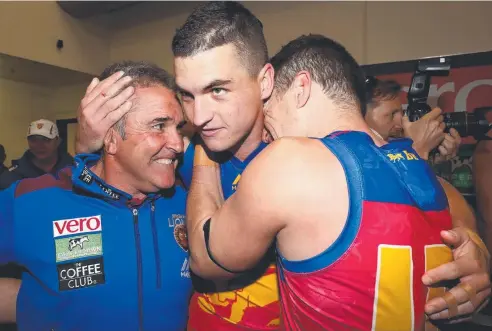  ?? Picture: GETTY IMAGES ?? UNIFIED: Chris Fagan, senior coach of the Lions, with players Tom Rockliff (centre) and Dayne Zorko, has helped orchestrat­e a form turnaround for the once-struggling Brisbane side, and hopes the Gold Coast Suns will be able to do the same.