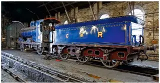  ?? DAVID WILCOCK ?? On ‘thin’ tender tyres, the Strathspey Railway’s figurehead locomotive - Caledonian Railway ‘812’ class 0-6-0 No. 828 - languishes in the works at Aviemore earlier this year, awaiting new tyres from Germany. They arrived in September - but were the...