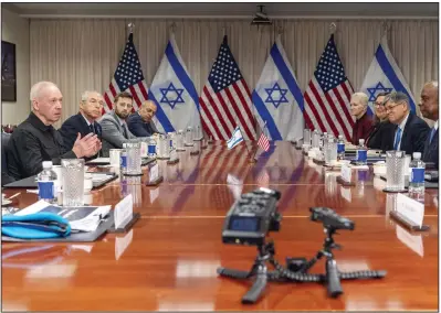  ?? (AP/Jacquelyn Martin) ?? Israeli Defense Minister Yoav Gallant (front left) speaks while meeting with Defense Secretary Lloyd Austin (front right) Tuesday at the Pentagon in Washington.