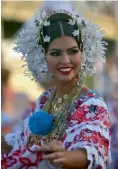  ?? — AFP ?? A reveller takes part in the Panama Carnival parade on Sunday.