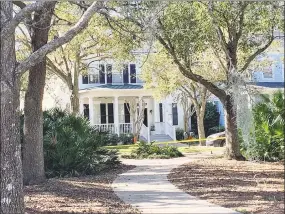  ?? WESH TV, NBC Orlando ?? This is the home in Celebratio­n, Fla. where deputies are conducting a death investigat­ion. Neighbors say around 9:30 a.m. on Monday the father of the family that lives in the home was seen being ordered out by deputies with guns drawn and was taken away in handcuffs.