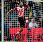  ??  ?? JUMP FOR JOY: Nathan Redmond puts Southampto­n ahead on the stroke of half-time